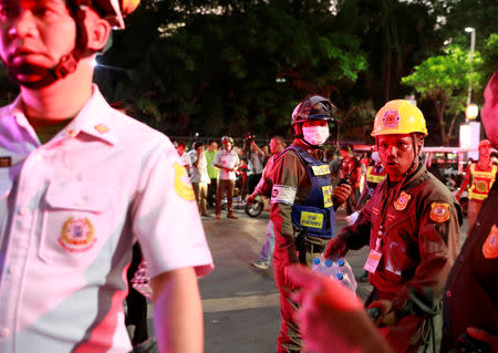 Rescue workers work after the Central World Complex was evacuated due to a fire, in Bangkok, Thailand, April 10, 2019. REUTERS/ Soe Zeya Tun