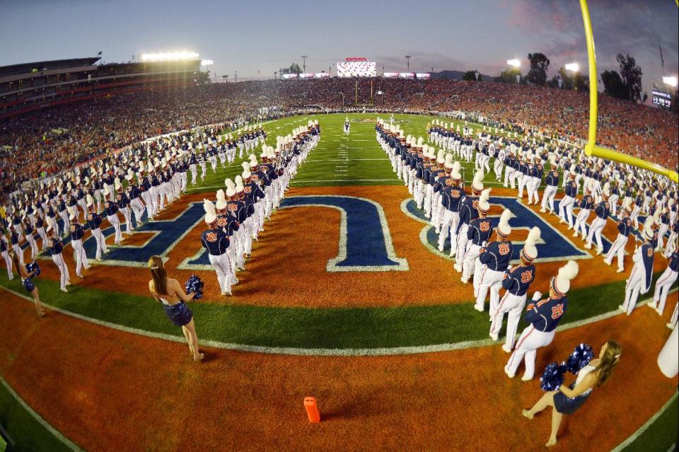 The Auburn band takes the field before the NCAA BCS National Championship college football game against Florida State Monday, Jan. 6, 2014, in Pasadena, Calif. (AP Photo/Mark J. Terrill)