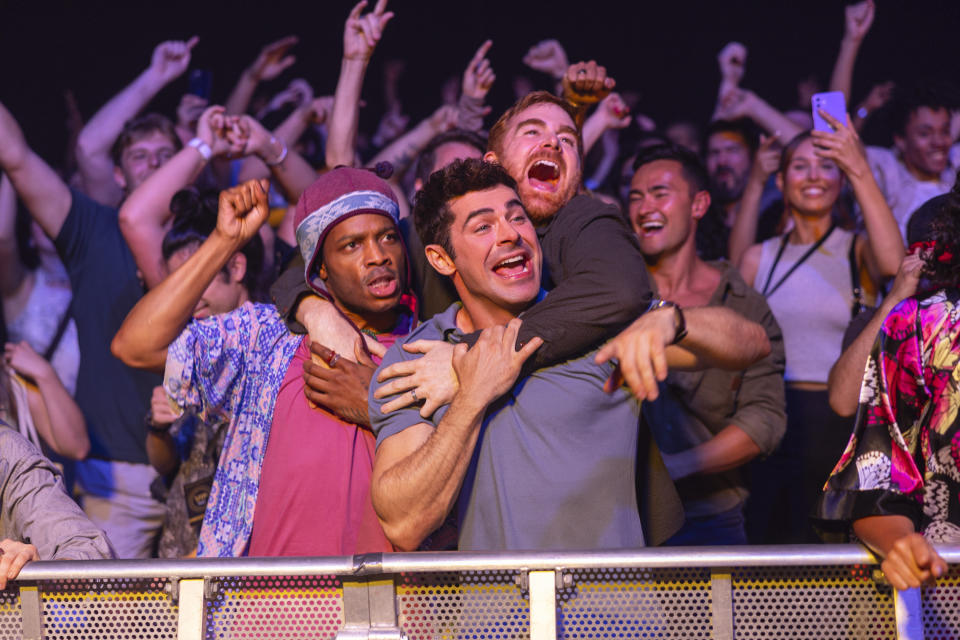 This image released by Amazon Prime shows, from left, Jermaine Fowler, Zac Efron and Andrew Santino in a scene from "Ricky Stanicky." (Ben King/Amazon via AP)