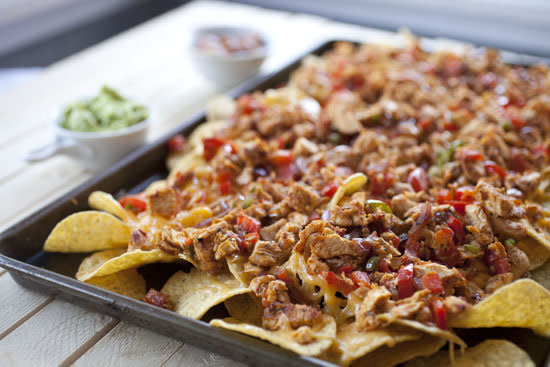 <strong>Get the <a href="http://www.macheesmo.com/2012/10/chicken-fajita-nachos/">Chicken Fajita Nachos recipe from Macheesmo</a></strong>