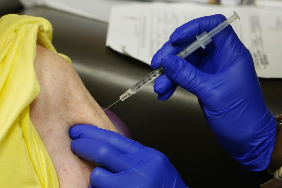 Linda Busby, 74, receives the Johnson & Johnson COVID-19 vaccine at the Aaron E. Henry Community Health Service Center, Wednesday, April 7, 2021, in Clarksdale, Miss. Busby joined a group of seniors from the Rev. S.L.A. Jones Activity Center for the Elderly that were given a ride to the health center for their vaccinations. The Mississippi Department of Human Services is in the initial stages of teaming up with community senior services statewide to help older residents get vaccinated. (AP Photo/Rogelio V. Solis)