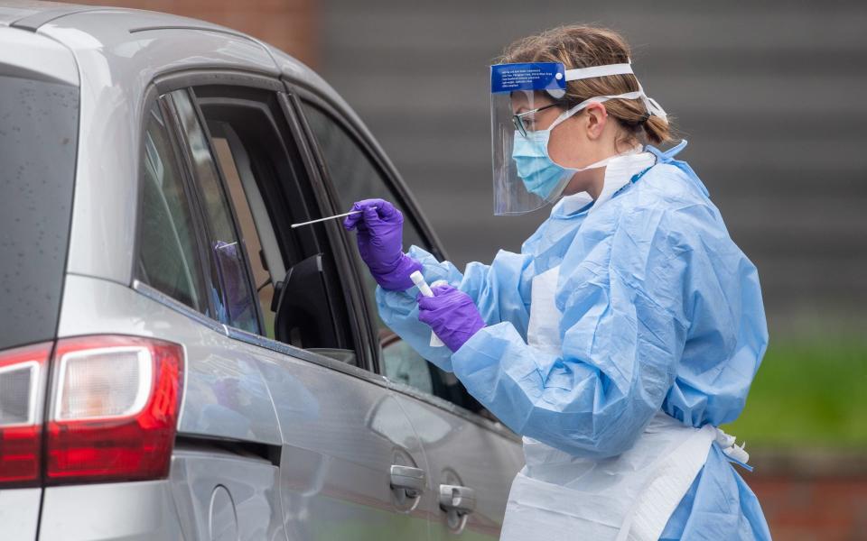 HS staff carry out Coronavirus tests at a testing facility in Bracebridge Heath, Lincoln - PA 