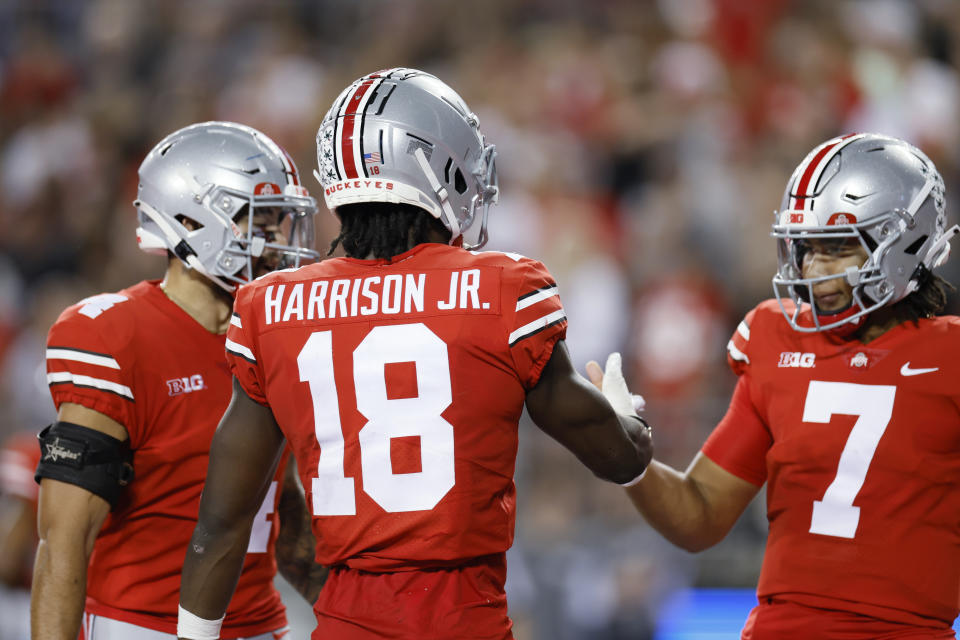 Ohio State receiver Marvin Harrison, center, celebrates his touchdown against Toledo with teammates during the first half of an NCAA college football game Saturday, Sept. 17, 2022, in Columbus, Ohio. (AP Photo/Jay LaPrete)