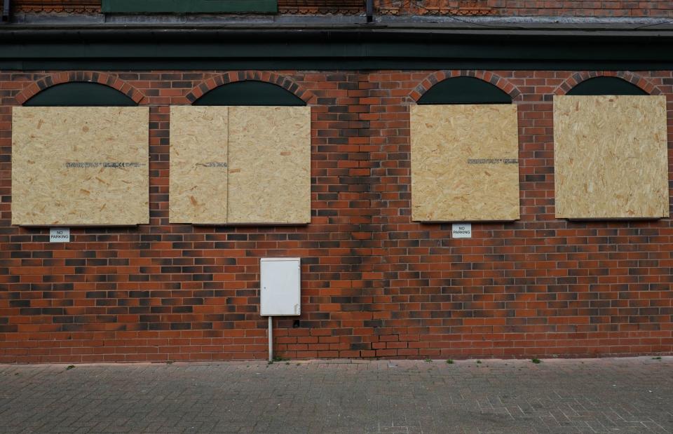 Boarded up windows at one of the mosques (PA)