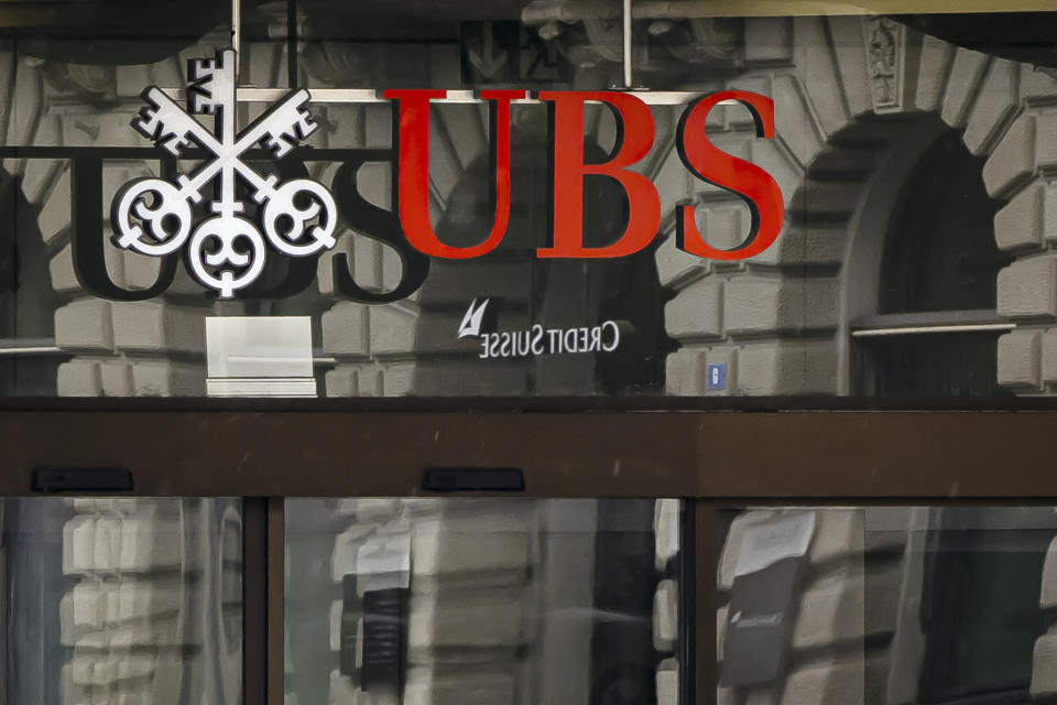 The logos of the Swiss banks Credit Suisse and UBS are displayed at Paradeplatz in Zurich, Switzerland, Sunday March 19, 2023. (Michael Buholzer/Keystone via AP)