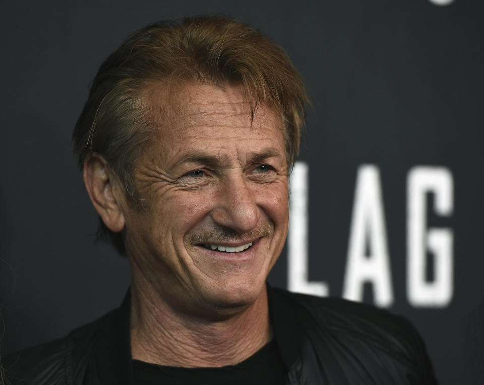 FILE - In this Aug. 11, 2021 file photo, Sean Penn arrives at the Los Angeles premiere of "Flag Day" at the Directors Guild of America Theater in Los Angeles. A disaster relief organization founded by Penn is boosting Georgia's drive to inoculate people against the coronavirus, though some of its pop-up vaccine clinics have struggled to attract people.(Photo by Jordan Strauss/Invision/AP, File)