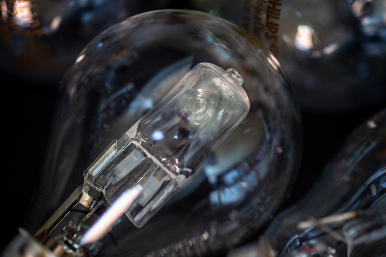 In a halogen bulb, halogen gas mixes with vapor from the tungsten filament. 