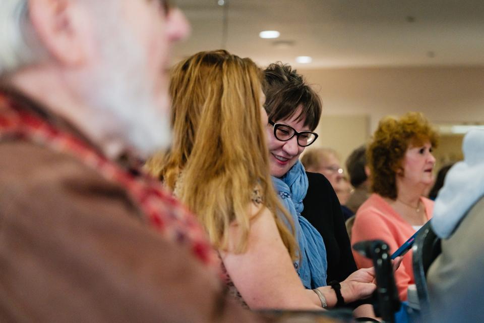 Annette Cookson, right, from New Philadelphia, sings along during a special performance by the T-County Ukulele Squad, Tuesday, at the Tuscarawas County Senior Center in Dover.