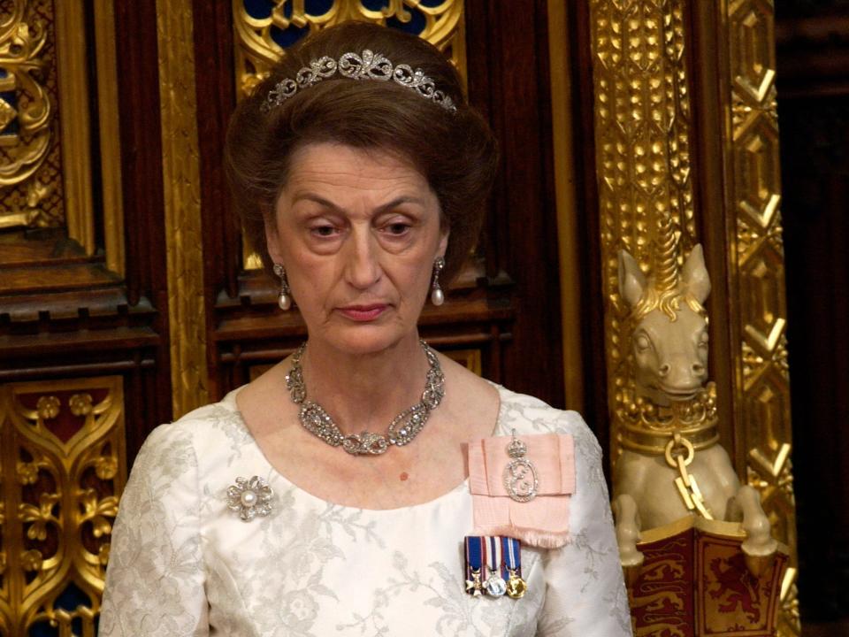 Lady Susan Hussey, a lady-in-waiting, accompanies the Queen at the State Opening of Parliament held in the House of Lords in November 2004.