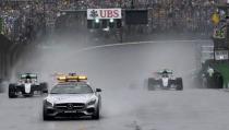 Formula One - F1 - Brazilian Grand Prix - Circuit of Interlagos, Sao Paulo, Brazil - 13/11/2016 - Mercedes' Lewis Hamilton of Britain (L) follows the safety car at the start of the race. REUTERS/Nacho Doce