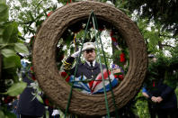 <p>Mike Denney, deputy chief of the Finderne Fire Department in Bridgewater, N.J., salutes after placing a reef during a Memorial Day observance ceremony, Monday, May 29, 2017, in Bridgewater, N.J. (Photo: Julio Cortez/AP) </p>