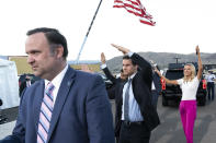 In this Oct. 18. 2020 photo, White House social media director Dan Scavino, left, Director of the White House Presidential Personnel Office John McEntee, and White House press secretary Kayleigh McEnany, watch and dance as President Donald Trump departs after speaking at a campaign rally at Carson City Airport, in Carson City, Nev. President Donald Trump, a man who is famously particular about his appearance, is fully embracing doing a dad dance to the Village People's “YMCA” as the finale to his rallies in the campaign's closing stretch.(AP Photo/Alex Brandon)