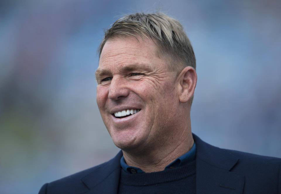 Former Australian spin bowler Shane Warne (pictured) smiling during commentary.