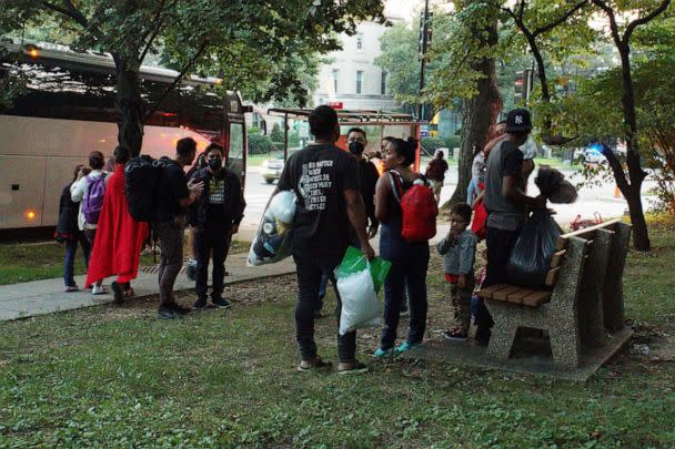 PHOTO: A group of mainly Venezuelan migrants, who were sent by bus from detention in Texas and then dropped off outside the Naval Observatory, the official residence of U.S. Vice President Kamala Harris, wait for transport in Washington, Sept. 17, 2022. (Marat Sadana/Reuters)