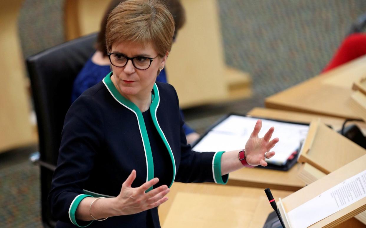 Nicola Sturgeon has previously used to impending publication of the report to avoid answering questions over the practice - RUSSELL CHEYNE/AFP