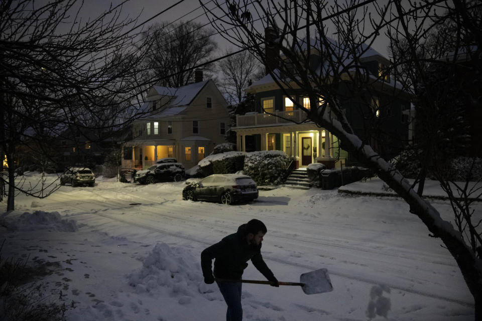 Colin Ladd clears snow from the sidewalk in front of his house Sunday, Jan. 7, 2024, in Providence, R.I. A major winter storm bringing heavy snow and freezing rain to some communities spread across New England on Sunday morning, sending residents scurrying to pull out their shovels and snowblowers to clear sidewalks and driveways. (AP Photo/David Goldman)