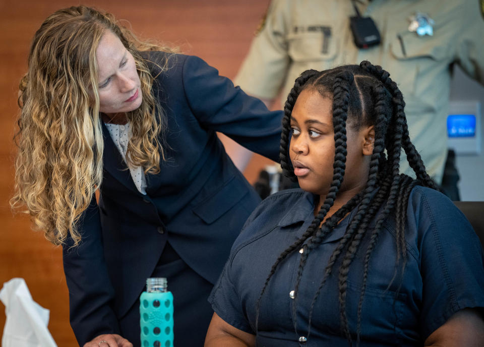 Pieper Lewis, right, speaks with attorney Magdalena Reese during a sentencing hearing Wednesday, Sept. 7, 2022. The Des Moines teen pleaded guilty to killing her alleged rapist in June 2020.