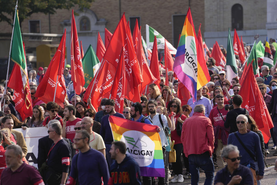 People gather during a march organized by the Italian Partisans association in Mussolini's birthplace Predappio Friday, Oct. 28, 2022, to mark the 78th anniversary of the liberation of the town from the nazi-fascist occupation by Italian Partisans and Polish allied troops, which coincides with the 100th anniversary of the march on Rome. (AP Photo/Luca Bruno)