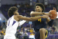 West Virginia guard Miles McBride (4) drives inside as TCU guard PJ Fuller (4) defends during the first half of an NCAA college basketball game, Saturday, Feb. 22, 2020 in Fort Worth, Texas. (AP Photo/Ron Jenkins)