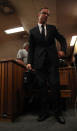 Oscar Pistorius leaves the dock after the prosecution closed its case in his murder trial in Pretoria, South Africa, Tuesday, March 25, 2014. Pistorius is charged with the Valentines Day 2013 shooting death of his girlfriend Reeva Steenkamp. (AP Photo/Esa Alexander, Pool)