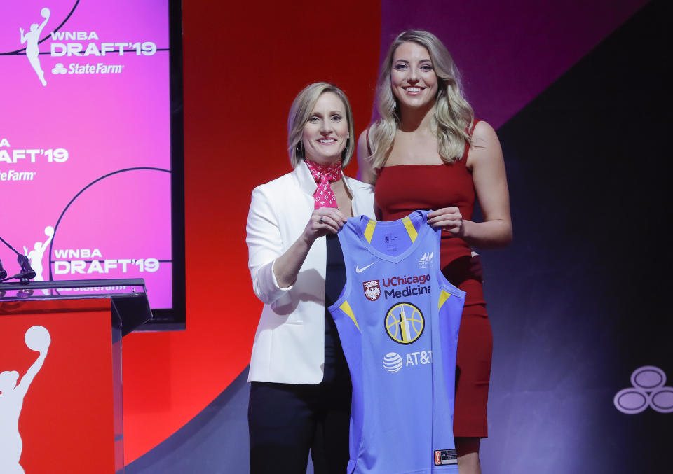 Connecticut's Katie Lou Samuelson, right, poses for a photo with WNBA COO Christy Hedgpeth after being selected by the Chicago sky as the fourth overall pick in the WNBA basketball draft, Wednesday, April 10, 2019, in New York. (AP Photo/Julie Jacobson)