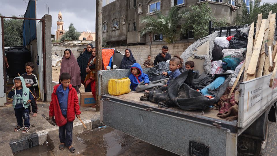 Children wait with their belongings in the back of a truck after Israel's evacuation order, May 6, 2024. - AFP/Getty Images