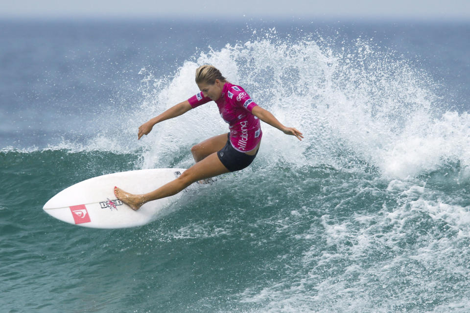 FILE - In this May 12, 2012, file photo, Australia's Stephanie Gilmore competes in the Association of Surfing Professionals, ASP, Billabong Rio Pro women's surfing competition at Barra da Tijuca beach in Rio de Janeiro, Brazil. Qualifying for the inaugural Olympic surfing competition at Tokyo 2020 has begun at Australia's Gold Coast with a World Surf League event where seven-time world champion Gilmore leads the women's field. Defending Gold Coast champion and fellow Australian Julian Wilson feature in a strong men's field that includes American great and 11-time world champion Kelly Slater and reigning series champion Gabriel Medina. (AP Photo/Felipe Dana, File)