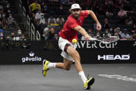 Team World's Reilly Opelka, of the USA, returns the ball to Team Europe's Casper Ruud, of Norway, at Laver Cup tennis, Friday, Sept. 24, 2021, in Boston. (AP Photo/Elise Amendola)