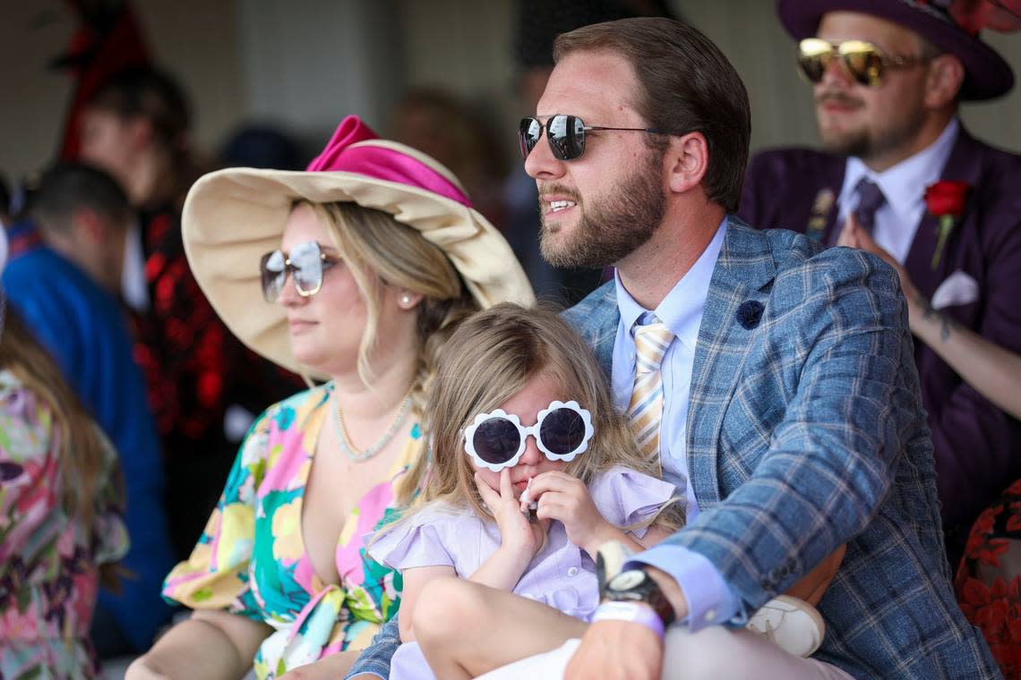 Spectators watch the action before the Kentucky Derby at Churchill Downs.