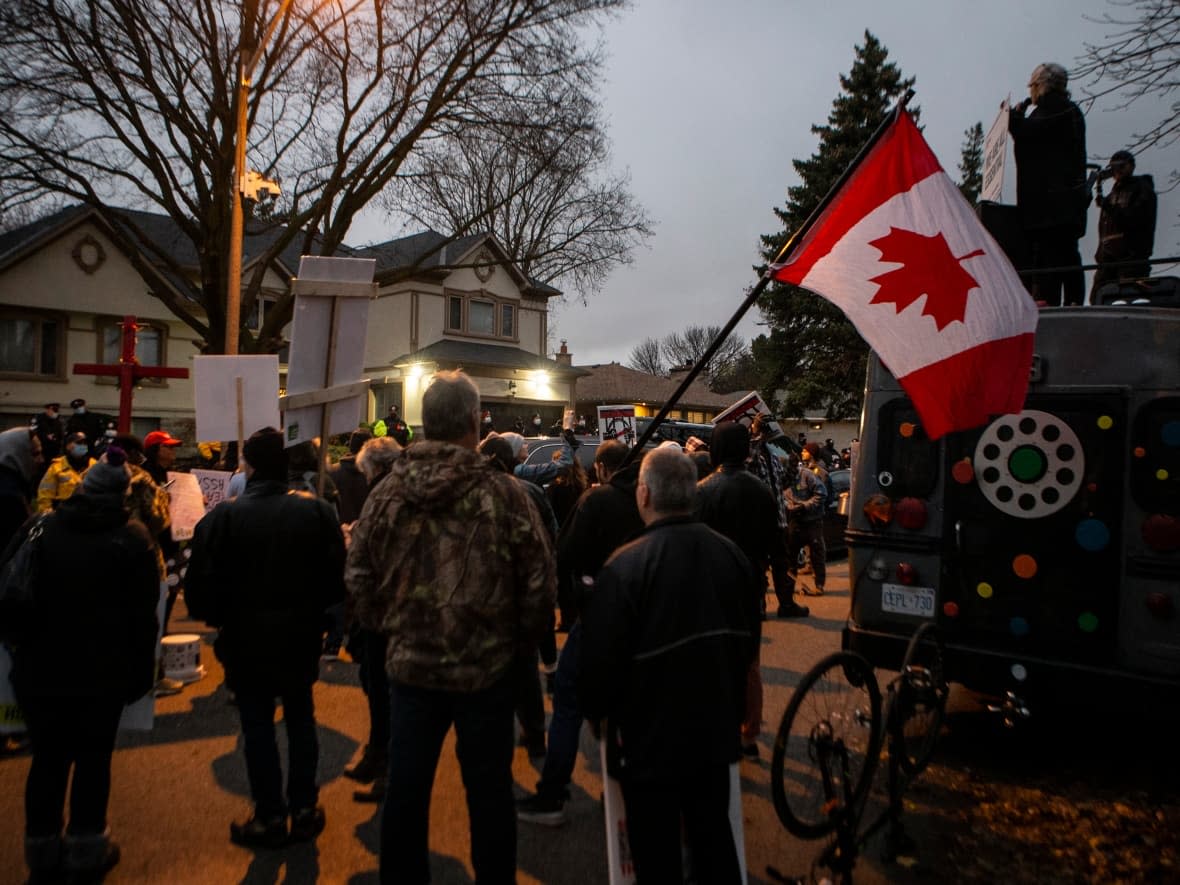 Protesters have gathered outside of Ontario Premier Doug Ford's house throughout the pandemic. In the image above, protesters in the fall of 2020 gathered outside Ford's house in Toronto to protest lockdown measures. (Chris Young/The Canadian Press - image credit)