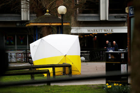 A tent covers the park bench where former Russian intelligence agent Sergei Skripal and his daughter Yulia were found after they were poisoned, in Salisbury, Britain March 12, 2018. REUTERS/Henry Nicholls