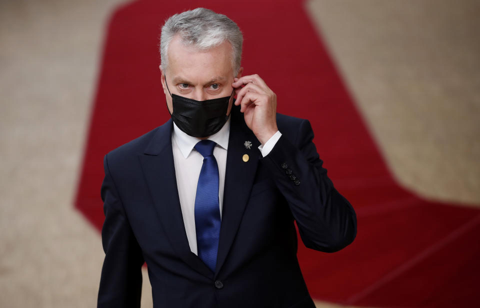 Lithuania's President Gitanas Nauseda arrives for an EU summit at the European Council building in Brussels, Thursday, Oct. 1, 2020. European Union leaders are meeting to address a series of foreign affairs issues ranging from Belarus to Turkey and tensions in the eastern Mediterranean. (AP Photo/Francisco Seco, Pool)