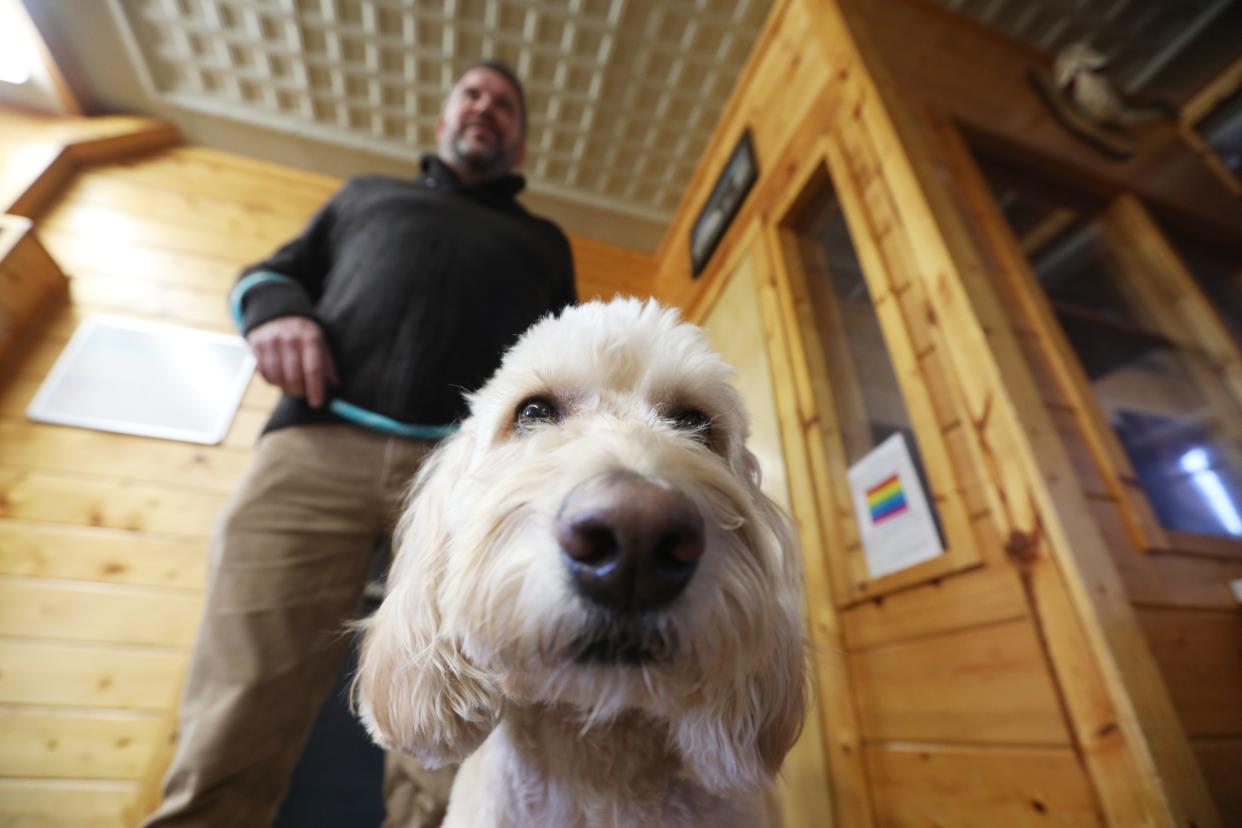 Director Gary King and therapy dog Daisy in the boy's common room at Avondale Youth Center. The center is the first in the state to receive the Qualified Residential Treatment Center certification from the federal government.