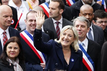 France's far right National Front political party leader Marine Le Pen (front) waves at supporters during the National Front's annual May Day rally in Paris May 1, 2014. REUTERS/Charles Platiau