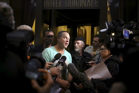 Peter Blenkiron (C), a child sex abuse victim, speaks to journalists in front of the Quirinale hotel in Rome, Italy, February 28, 2016. REUTERS/Alessandro Bianchi