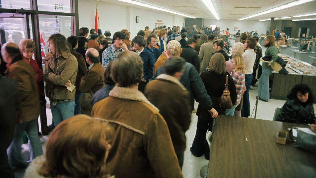 people waiting in line at the employment office