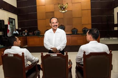 The leader of Gafatar group Ahmad Musadeq stands as he smiles during trial at East Jakarta district court in Indonesia, March 7, 2017 in this photo taken by Antara Foto. Picture taken March 7, 2017. Antara Foto/M Agung Rajasa/ via REUTERS