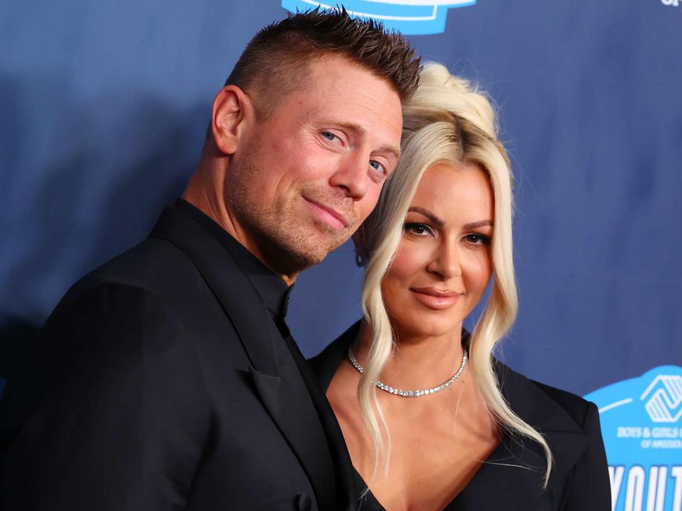 <p>Leon Bennett/Getty</p> Michael Mizanin and Maryse Mizanin attend the Boys & Girls Clubs of America