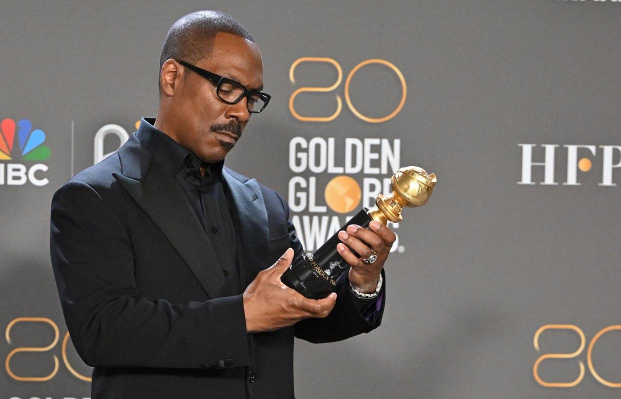 Actor Eddie Murphy poses with the Cecil B. DeMille award on Jan. 10, 2023 in the press room during the 80th annual Golden Globe Awards at The Beverly Hilton hotel in Beverly Hills, California.