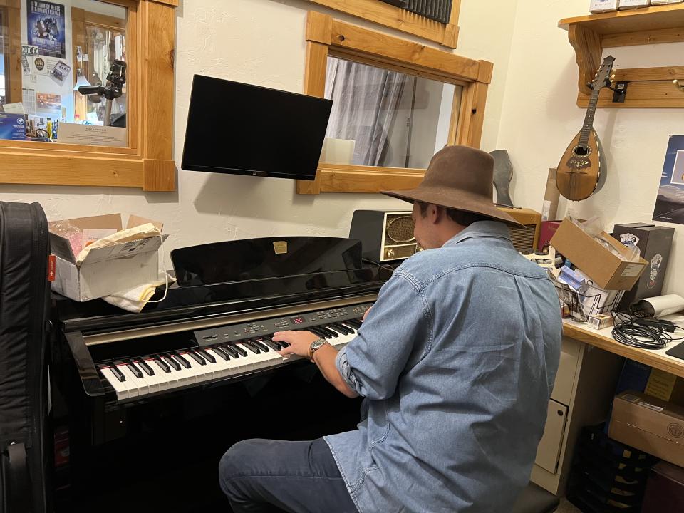 Ben Proudfoot tickles the ivories at the Telluride Music Company.