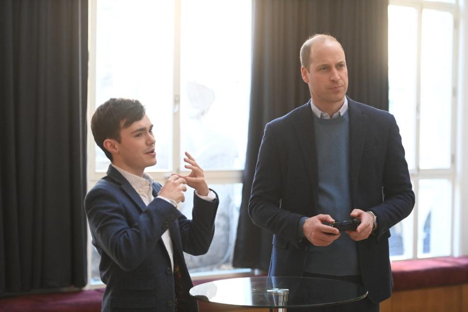 William tries his hand playing a game at Bafta’s HQ (Paul Grover/Daily Telegraph/PA) (PA Wire)