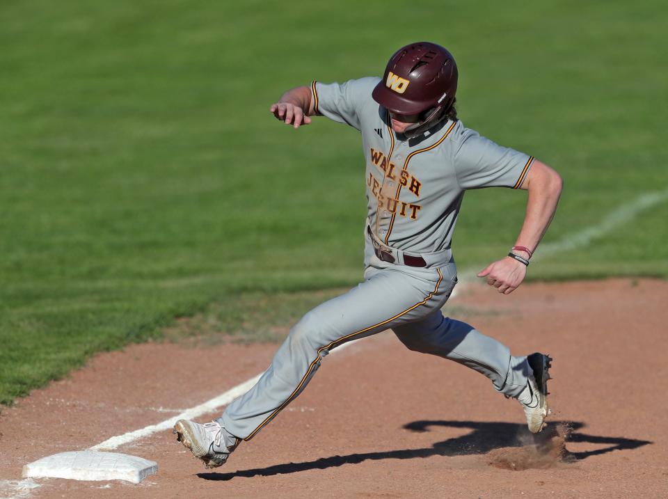 Walsh Jesuit baserunner Shawn Sullivan rounds third on his way to score during the fifth inning Monday in Cuyahoga Falls.