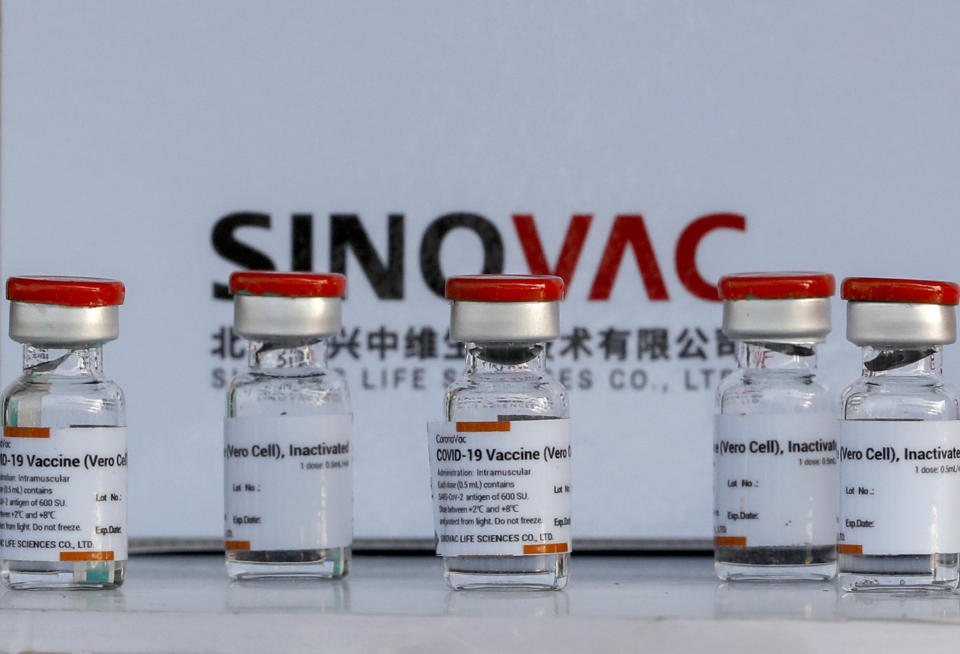 Samples of Sinovac vaccine are displayed at Suvarnabhumi airport in Bangkok, Thailand, Wednesday, Feb. 24, 2021, aheads of the arrival of first shipments of 200,000 doses of the Sinovac vaccine and 117,000 doses of the AstraZeneca vaccine on Feb. 24. (AP Photo/Sakchai Lalit)