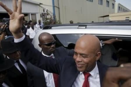 Haiti's former President Michel Martelly says goodbye after a ceremony marking the end of his presidential term, at the Haitian Parliament in Port-au-Prince, Haiti, February 7, 2016. REUTERS/Andres Martinez Casares