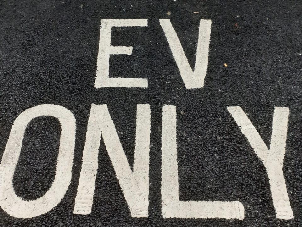 The words EV only are written in the parking bay at Shell Recharge Fulham, to let drivers know that it is only for electric vehicles.