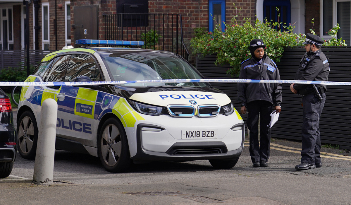 Police near the scene where a woman was found unresponsive in Hackney (Jordan Pettitt/PA Wire)