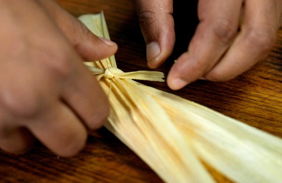 Latha restaurant chef Digby Stridiron plates saltfish and ducana, traditional foods eaten in the Caribbean for Easter on March 22, 2024, in Phoenix.