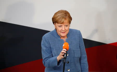 Christian Democratic Union CDU party leader and German Chancellor Angela Merkel gives a speech after winning the German general election (Bundestagswahl) in Berlin, Germany, September 24, 2017. REUTERS/Axel Schmidt