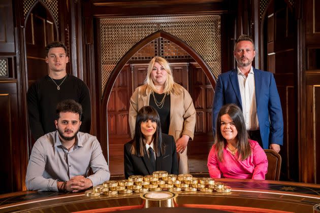 The Traitors finalists (clockwise from top) Aaron, Hannah, Kieran, Meryl and Wilfred with host , Claudia Winkleman (front centre).