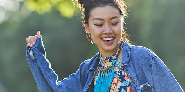 young east asian appearing woman enjoying a warm summers evening